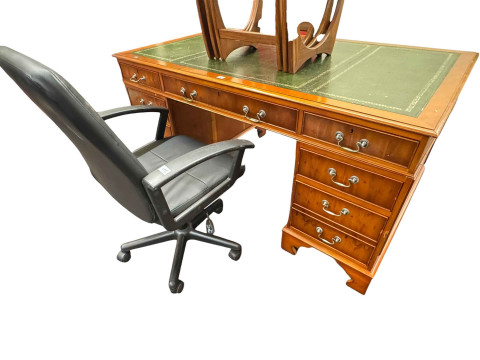 Yew eight drawer pedestal desk, 76cm by 152cm by 91cm together with a...