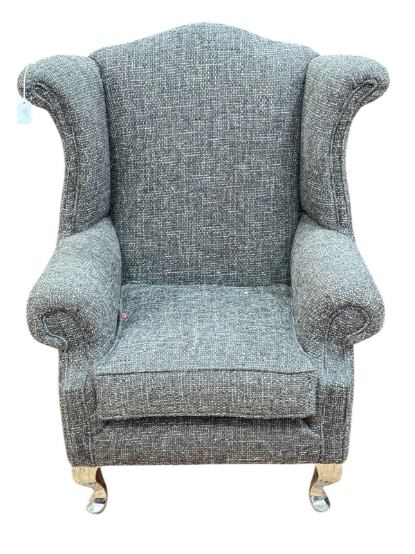 Childs wing armchair on silvered legs.