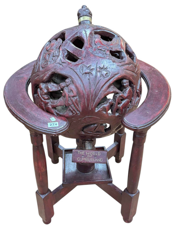 The World of Cumberland carved revolving globe on stand.