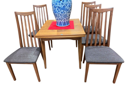 Teak draw leaf dining table and set of five rail back dining chairs, table...