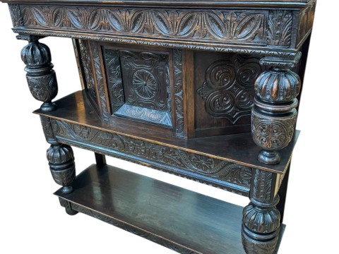 Victorian carved oak buffet, the canopy top above a central door and canted...