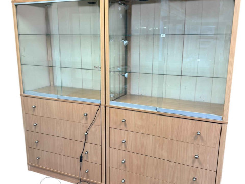 Pair beech finish illuminated shop display cabinets having two sliding...