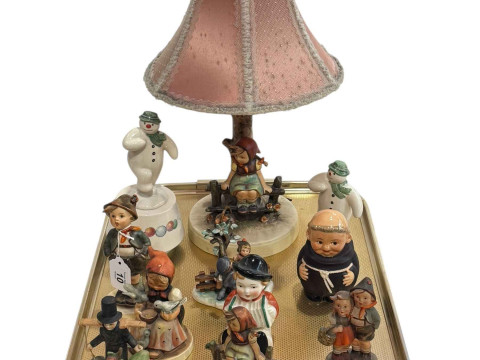 Hummel lamp, ten Hummel figures and monk, two Royal Doulton Snowman figures.