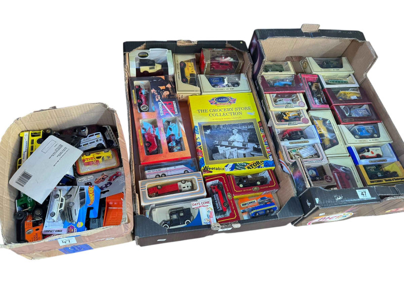 Three boxes of Lledo, Matchbox and other model vehicles.