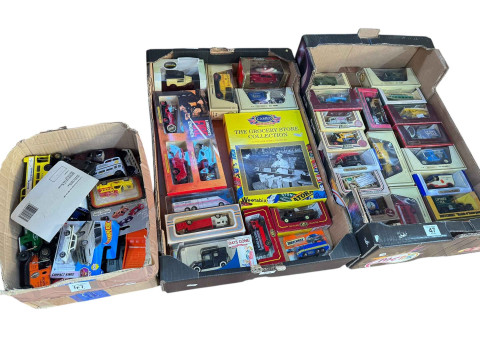 Three boxes of Lledo, Matchbox and other model vehicles.
