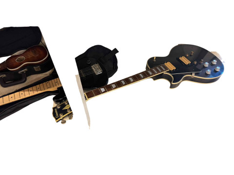 Collection of nine various guitars and ukeleles. thumbnail