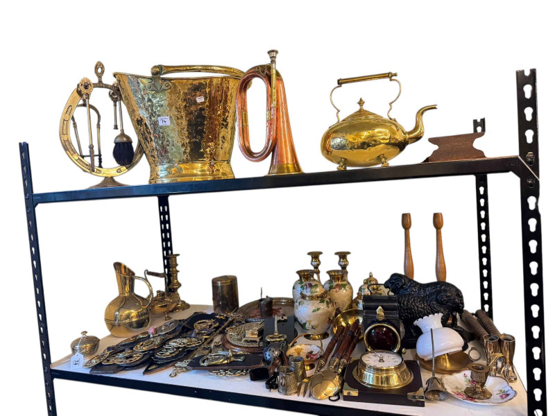 Collection of copper and brass wares, including beaten brass coal bucket, copper bugle, Martingales, two cast iron ram door stops, warming pan etc.