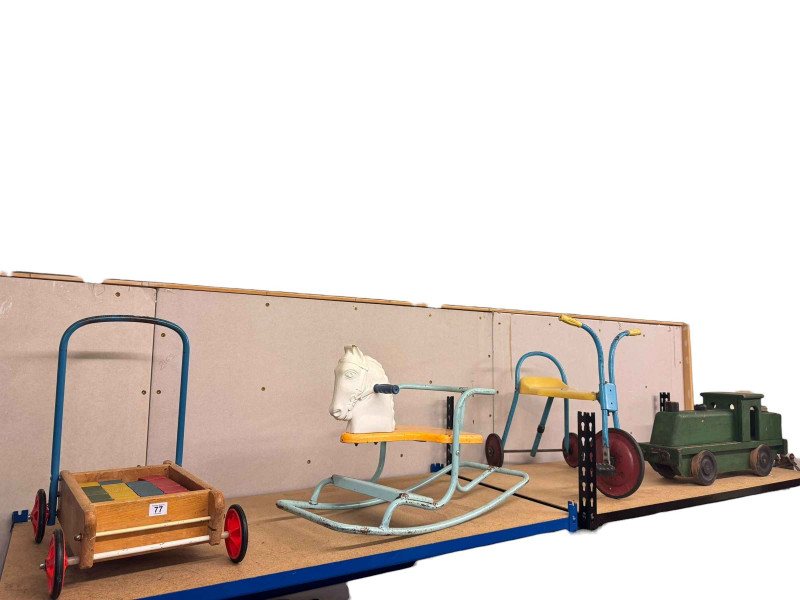 Four vintage toys including Triang rocker, baby walker etc.