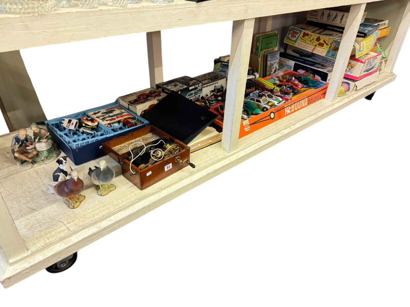 Two Beswick pigeons, antique Magneto electric machine, stamp album, toy cars and vintage games.