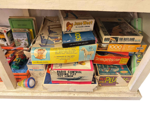 Two Beswick pigeons, antique Magneto electric machine, stamp album, toy cars and vintage games. thumbnail