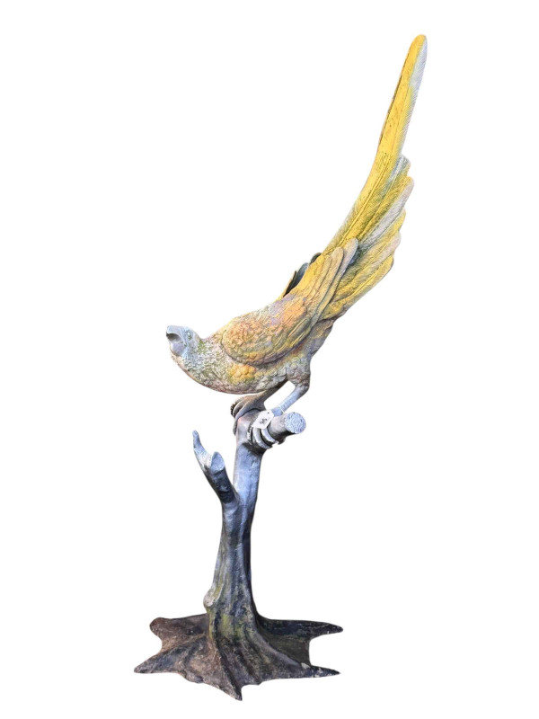 Large cast metal painted model of a parrot on branch, 124cm.