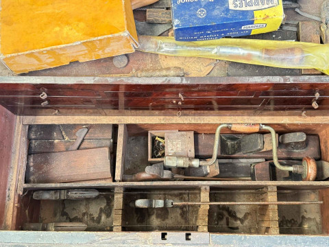 Large pine tool box with well fitted interior and collection of tools, including plates, saws, chisels. thumbnail