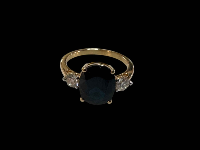 Oval sapphire and diamond three-stone ring, set in 18 carat yellow gold, size L.