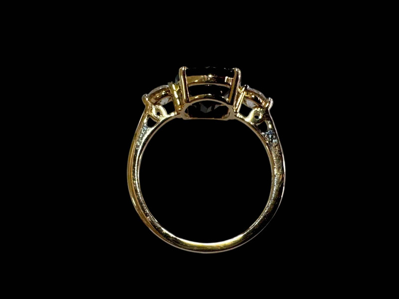 Oval sapphire and diamond three-stone ring, set in 18 carat yellow gold, size L.