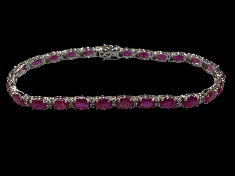 Ruby and diamond bracelet set in 18 carat white gold, rubies 9.40cts and diamonds 0.48cts.