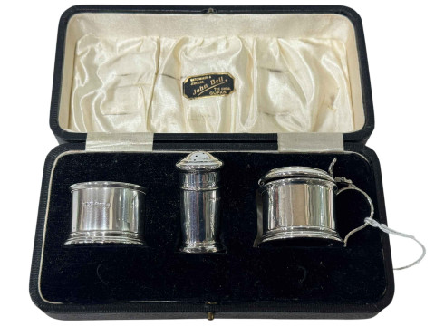 Cased silver cruet set.