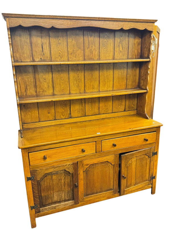 Oak six-drawer kneehole desk and oak three-door shelf back dresser (2).