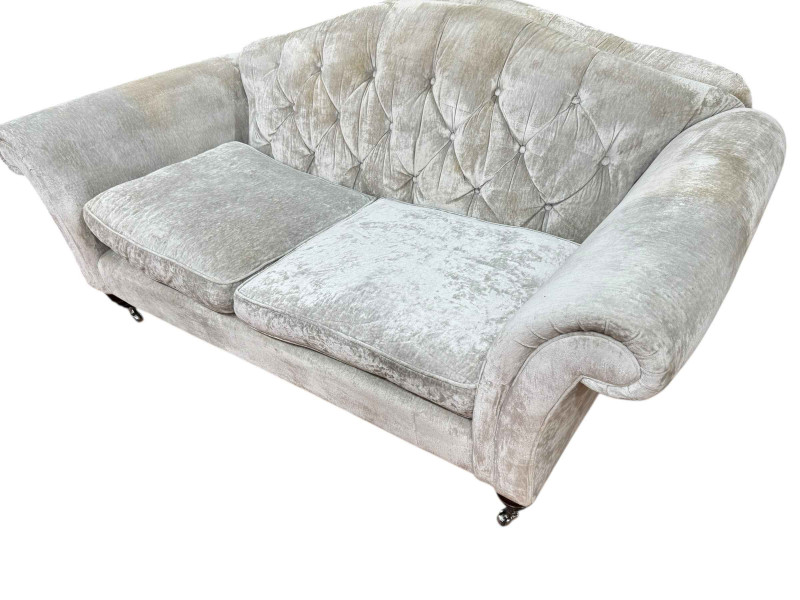 Pair Laura Ashley button back sofas in light plush fabric.