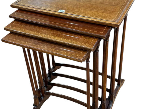 Quartetto nest of mahogany and line inlaid turned leg tables, largest...