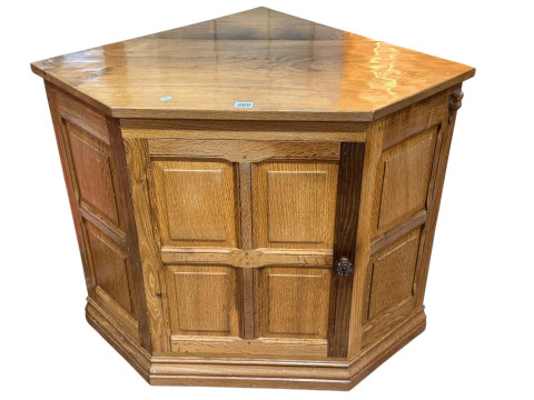 Colin 'Beaverman' Almack floor standing panelled oak single door corner...