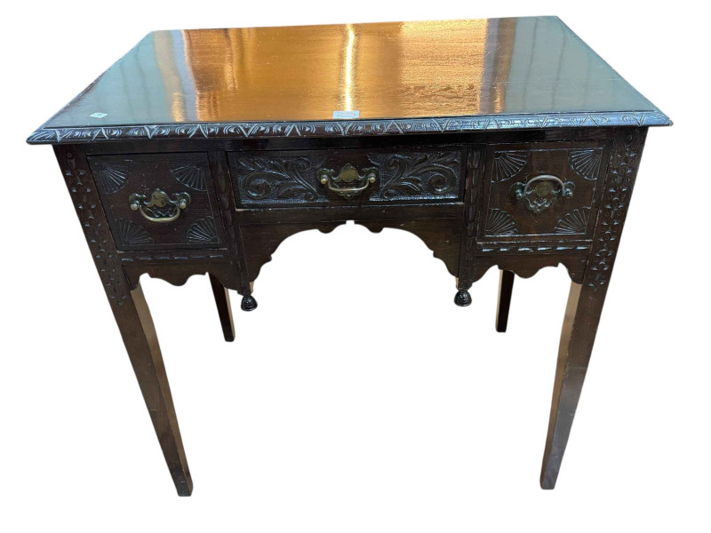 Carved oak three-drawer side table, 76 x 77 x 51cm.