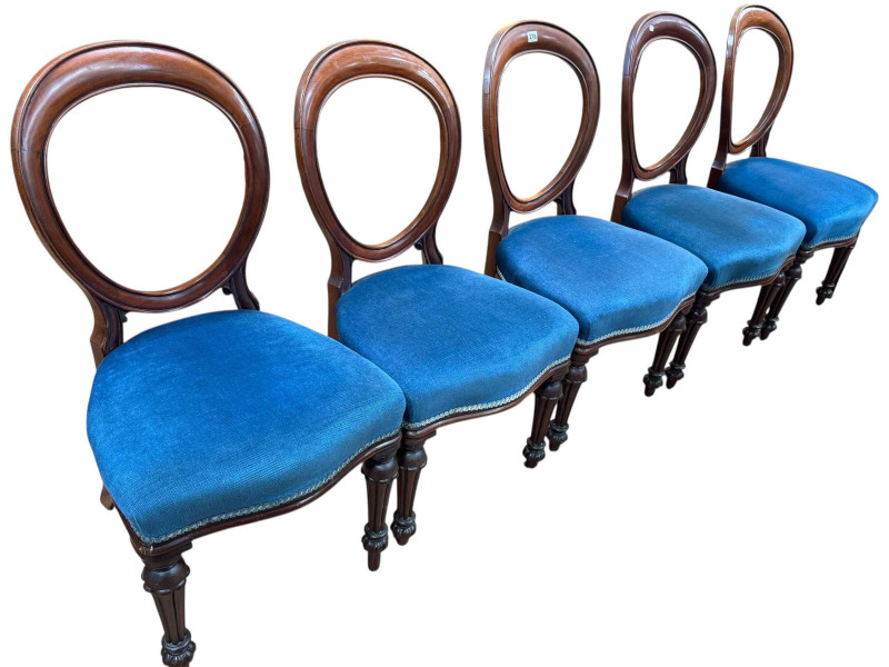 Set of five Victorian mahogany balloon back dining chairs with serpentine front seats.