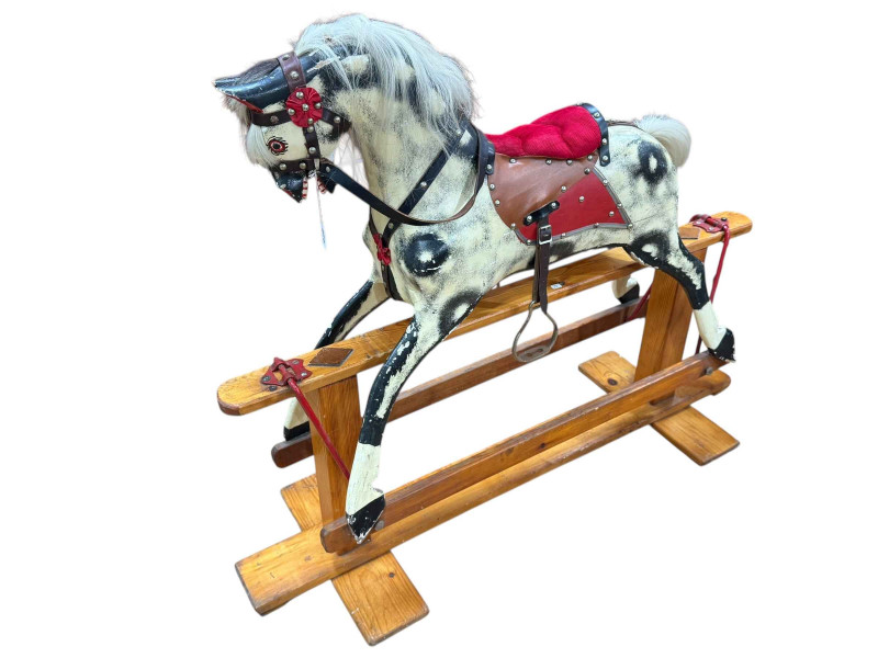 Sponge painted rocking horse on pine safety stand, 97 x 122cm.