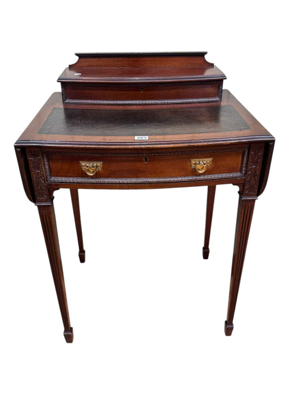 Late Victorian mahogany lady's writing desk having upper stationery compartment above a bow front drawer and drop sides, 86 x 62 x 38cm.