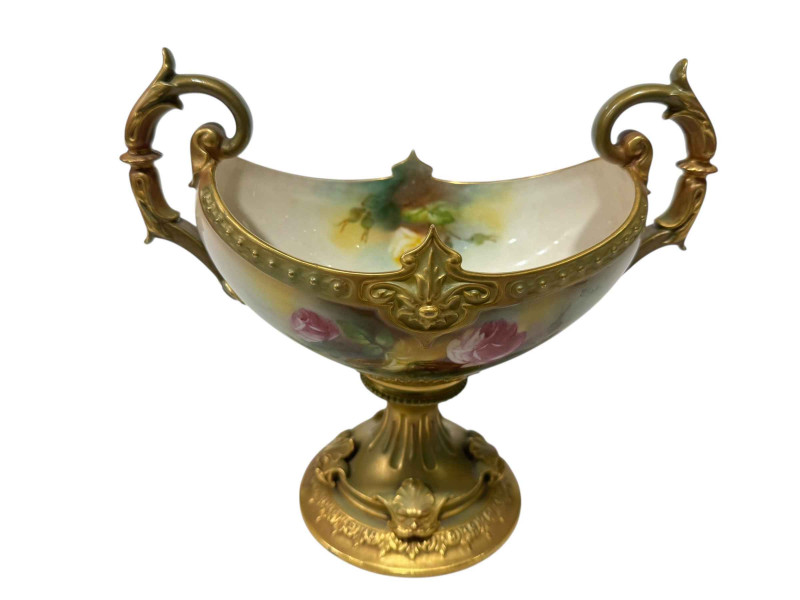 Royal Worcester two-handled tazza painted with roses by M Blake with green/gilt base, 18cm.