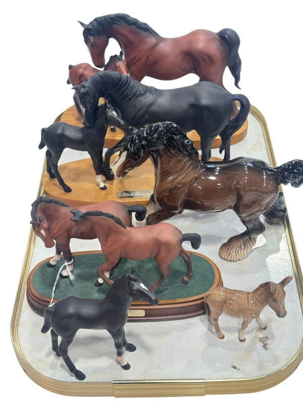 Collection of Beswick and Royal Doulton horses including Black Beauty and Foal, and Spirit of Affection.