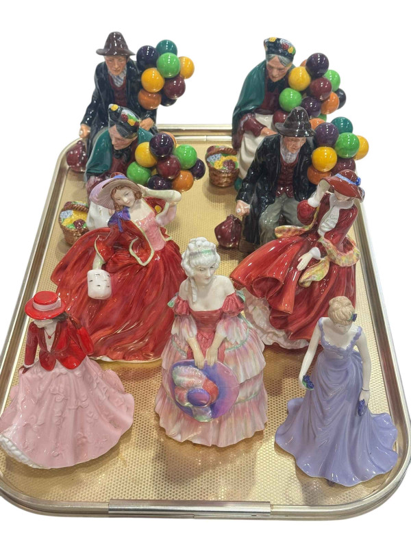 Seven Royal Doulton figures including two The Old Balloon Seller and two The Balloon Man, and two Royal Worcester figures.