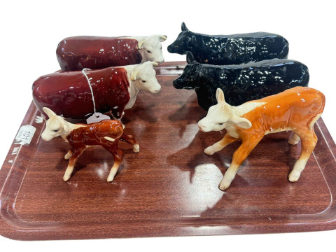 Two Beswick Hereford Cows and two Calves, and two Aberdeen Angus Cows.
