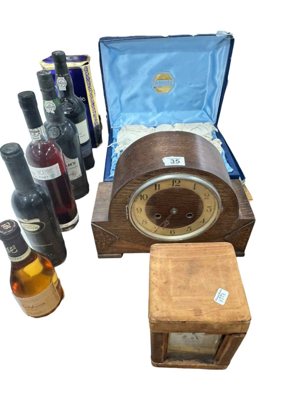 Pinwinnie Royal Scotch Whisky, three bottles of Port, Muscat liqueur and Plum liqueur, six Gleneagles crystal tumblers, oak mantel clock and cased carriage clock.