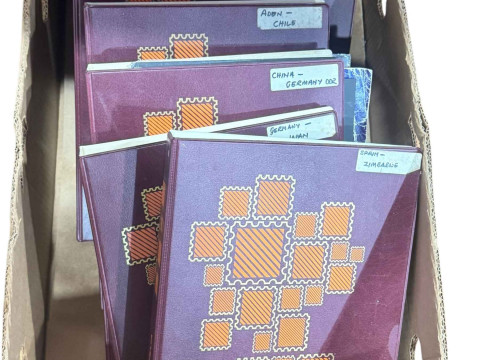 Six albums of European and Asian stamps.