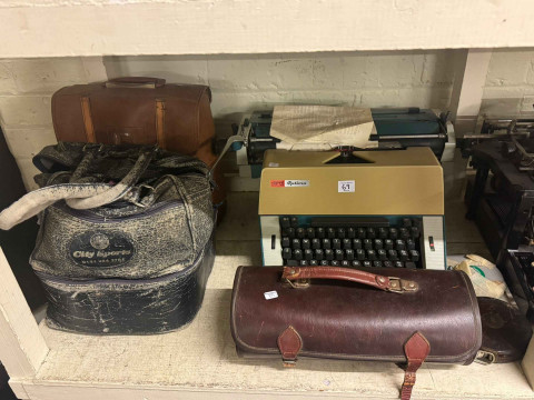 Full shelf of china, glass, silver plate, cameras, vintage typewriters, wood bowls, sewing machine, etc. thumbnail