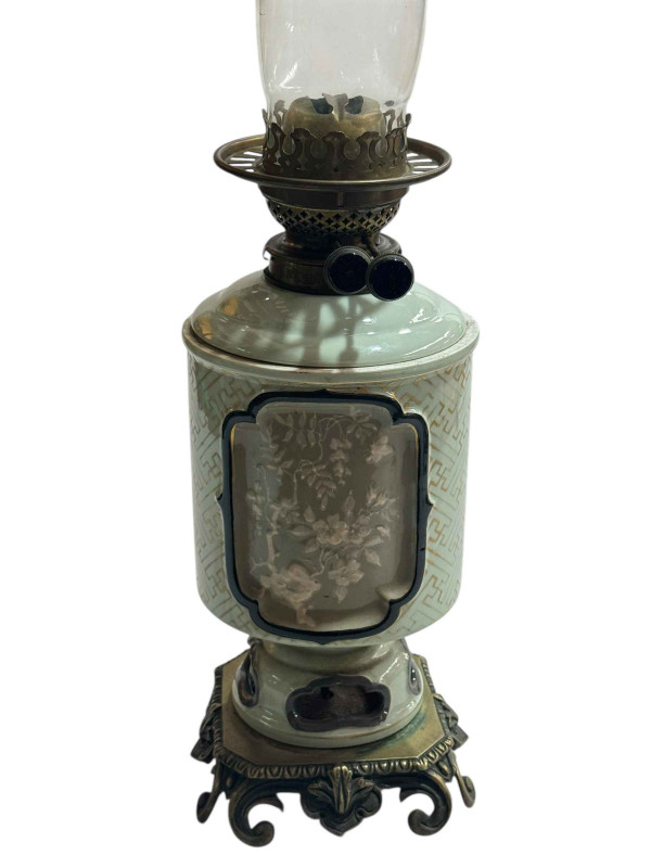 Chinese Celadon oil lamp with floral panel decoration on gilt metal base.