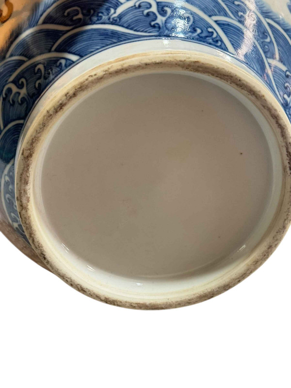 Large Chinese pottery vase decorated with dragon design on blue and white ground, 38cm.