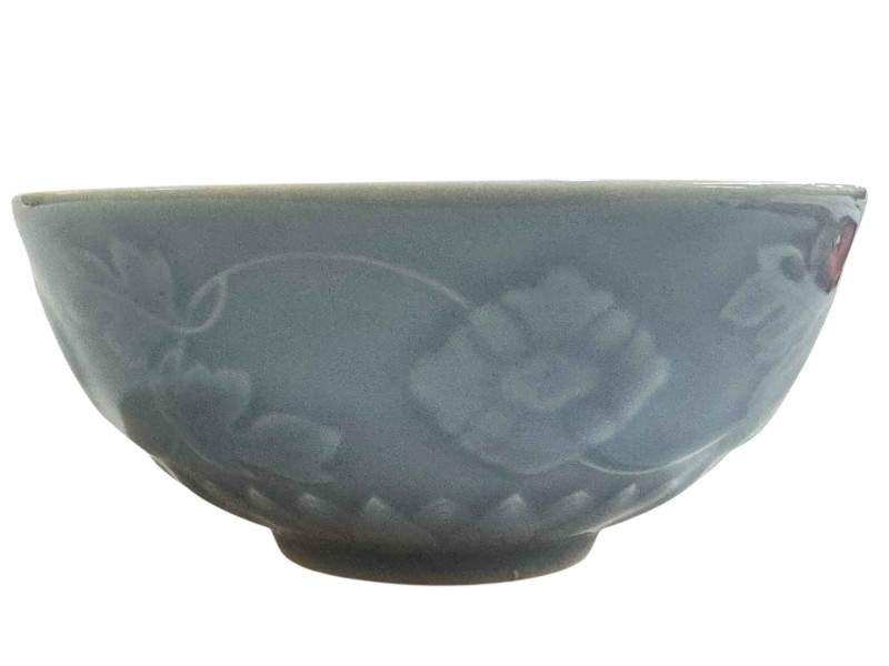 Chinese blue and white glazed pottery bowl with raised floral decoration with Yangzheng mark to base, 13cm diameter.