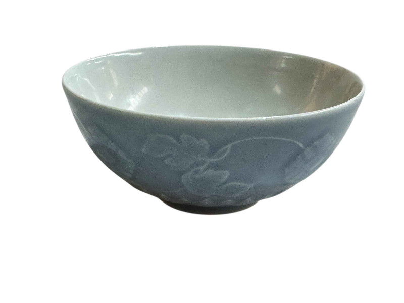 Chinese blue and white glazed pottery bowl with raised floral decoration with Yangzheng mark to base, 13cm diameter.