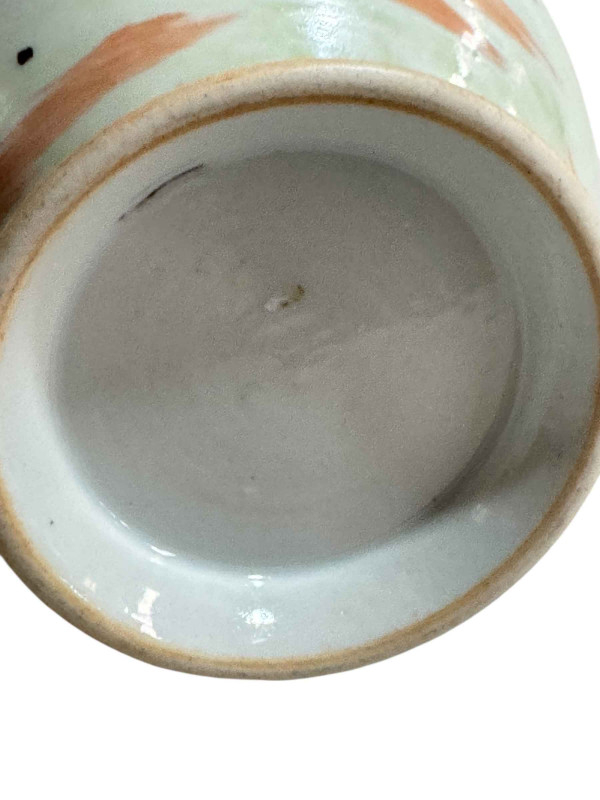 Chinese pottery vase decorated with figures and floral design, 23cm.