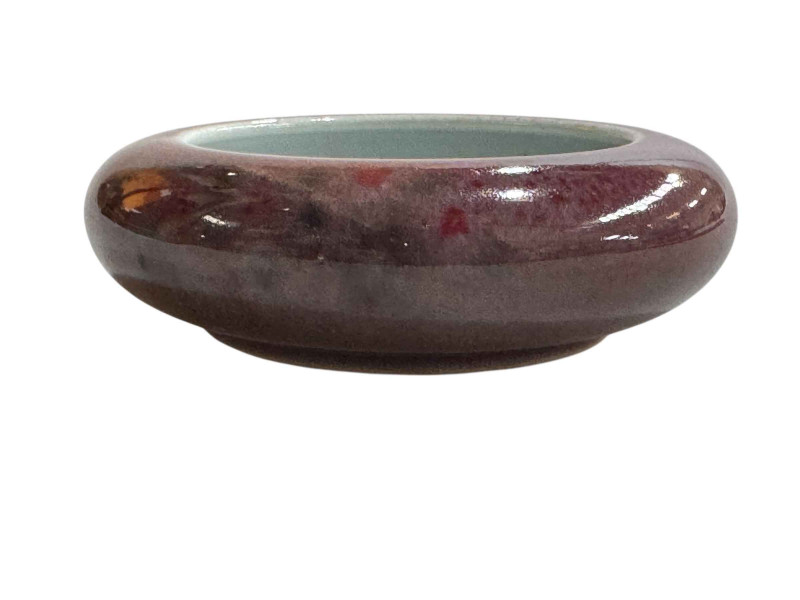 Chinese purple glazed pottery brush washer dish, six character Kangxi mark to base, 11.5cm diameter.