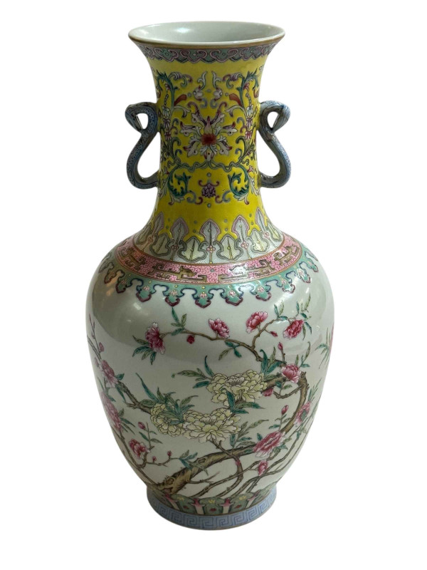 Chinese famille rose decorated vase with twin snake handles with iron red four character mark to base, 29cm.