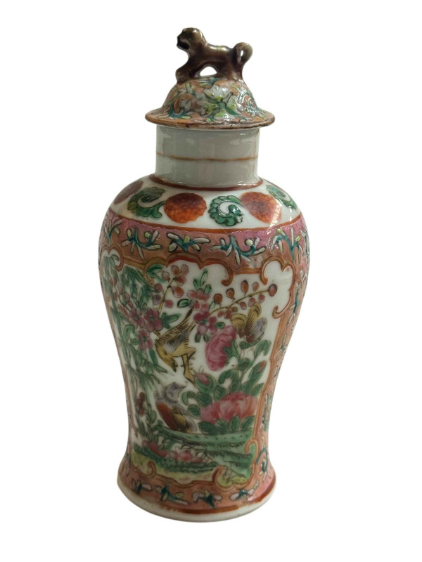 Small Chinese famille rose decorated lidded vase with bird and butterfly design and fo dog mount, 15.5cm.