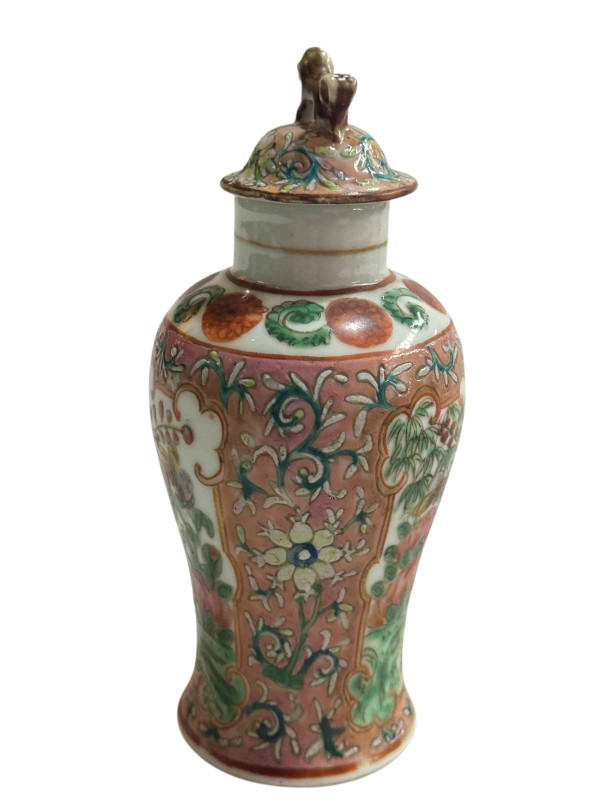 Small Chinese famille rose decorated lidded vase with bird and butterfly design and fo dog mount, 15.5cm.
