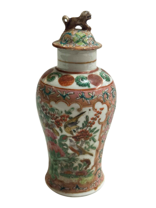 Small Chinese famille rose decorated lidded vase with bird and butterfly design and fo dog mount, 15.5cm.