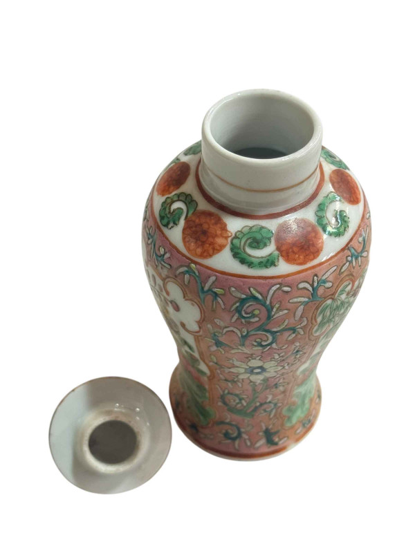 Small Chinese famille rose decorated lidded vase with bird and butterfly design and fo dog mount, 15.5cm.