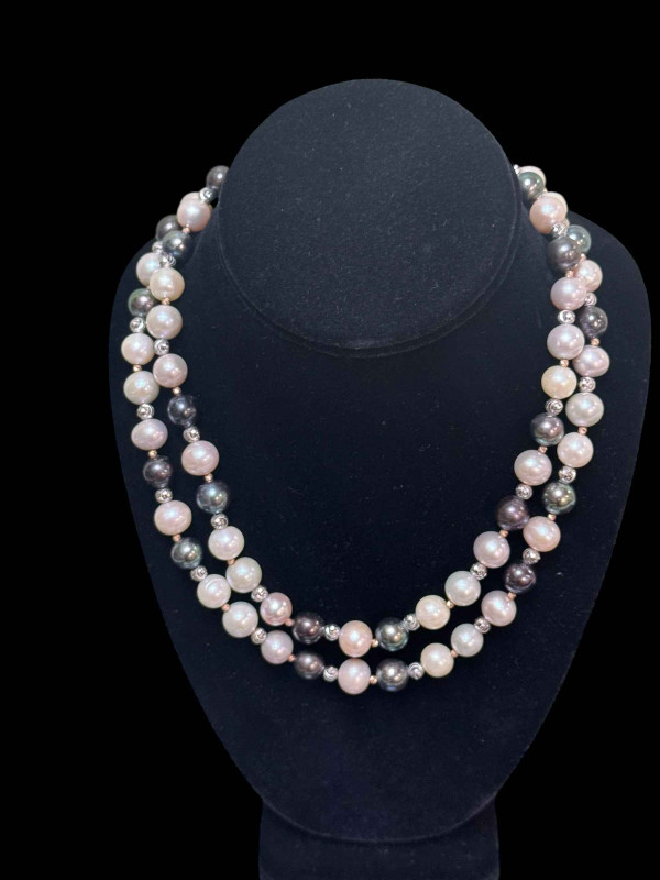 Long strand of black, white and silver pearls, total length approximately 90cm.
