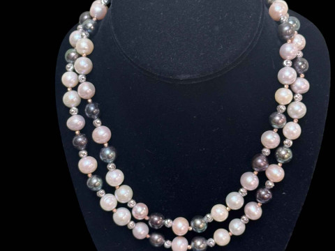 Long strand of black, white and silver pearls, total length approximately...