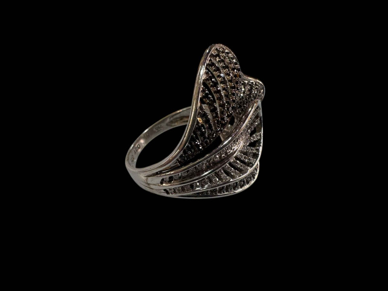 18 carat white gold cocktail ring set with black and white diamonds.