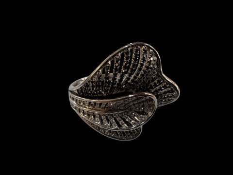 18 carat white gold cocktail ring set with black and white diamonds.